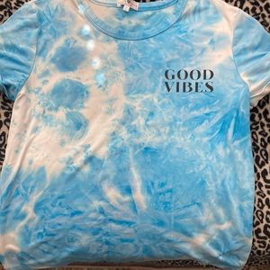 Blue with florals on the back Woman’s tees